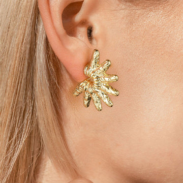 Golden, snowflake-shaped earrings