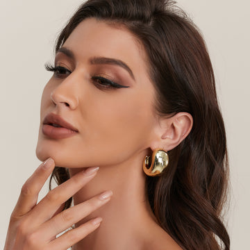 Golden, female pendant earrings