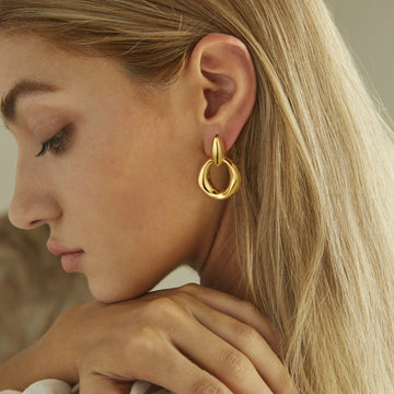 Gold, glossy solid small oval earrings with large circular hoops