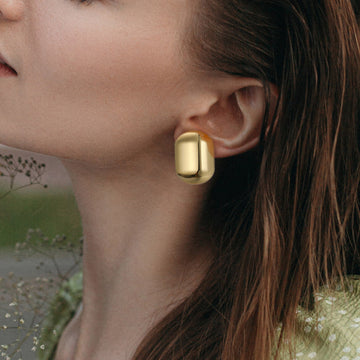 Golden, capsule-shaped earrings