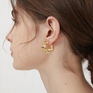 Golden-colored, open-ended five-pointed star earrings