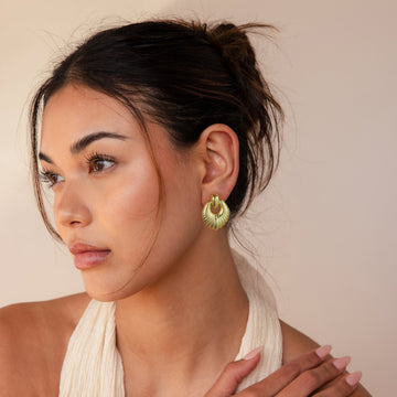 Golden, oval-shaped leaf earrings