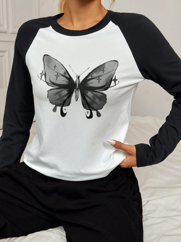 Women's long sleeved T-shirt, white body, black sleeves, black butterfly pattern on chest