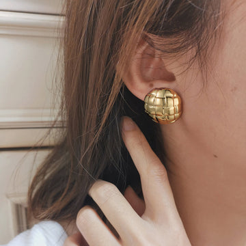 Golden, round earrings with an inner square pattern