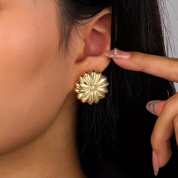 Golden-colored daisy-shaped earrings