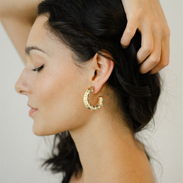 Golden, small C-shaped hoop earrings