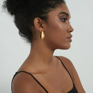 Golden, square handbag-shaped earrings