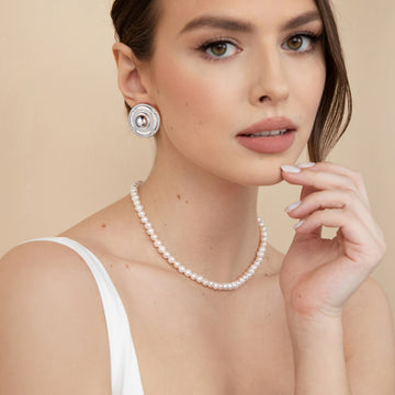 Silver/golden, round shield-shaped earrings
