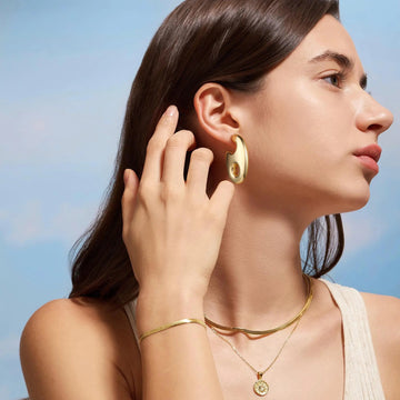 Golden, lobster claw-shaped earrings