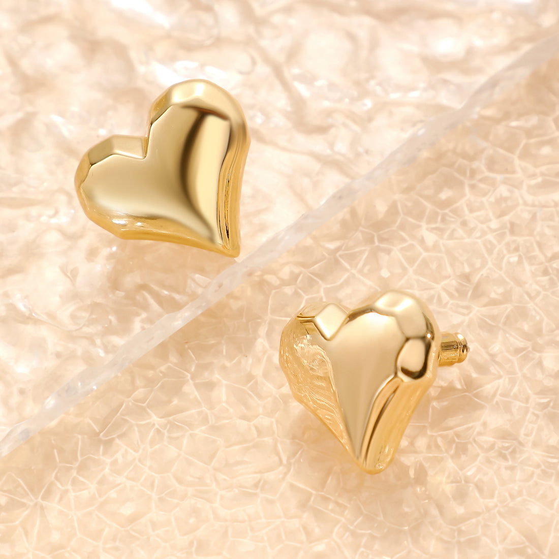 Golden, pointed heart-shaped earrings
