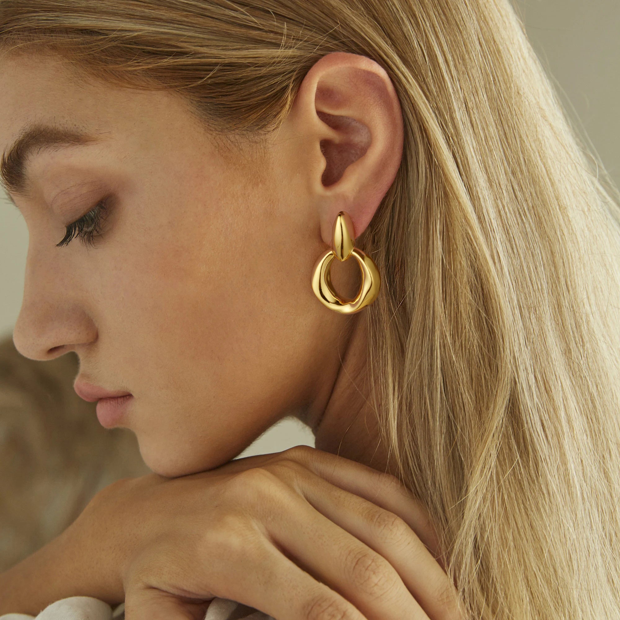 Gold, glossy solid small oval earrings with large circular hoops