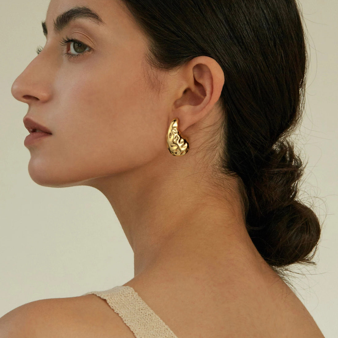 Golden, broad bean-shaped earrings