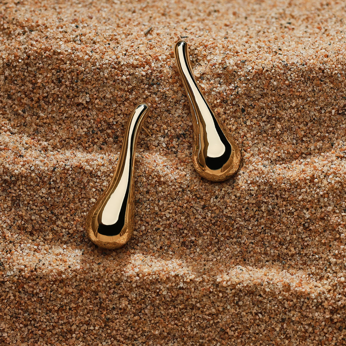 Golden-colored, trendy and popular, earrings with a strong sense of design