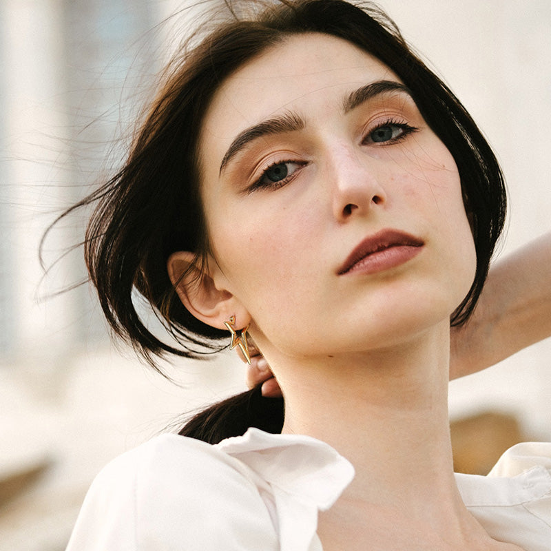 Golden, lightning shaped star earrings