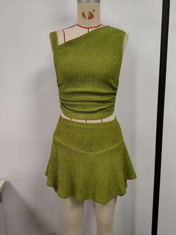 Green, suit skirt, top with one side exposed shoulder, short skirt hem