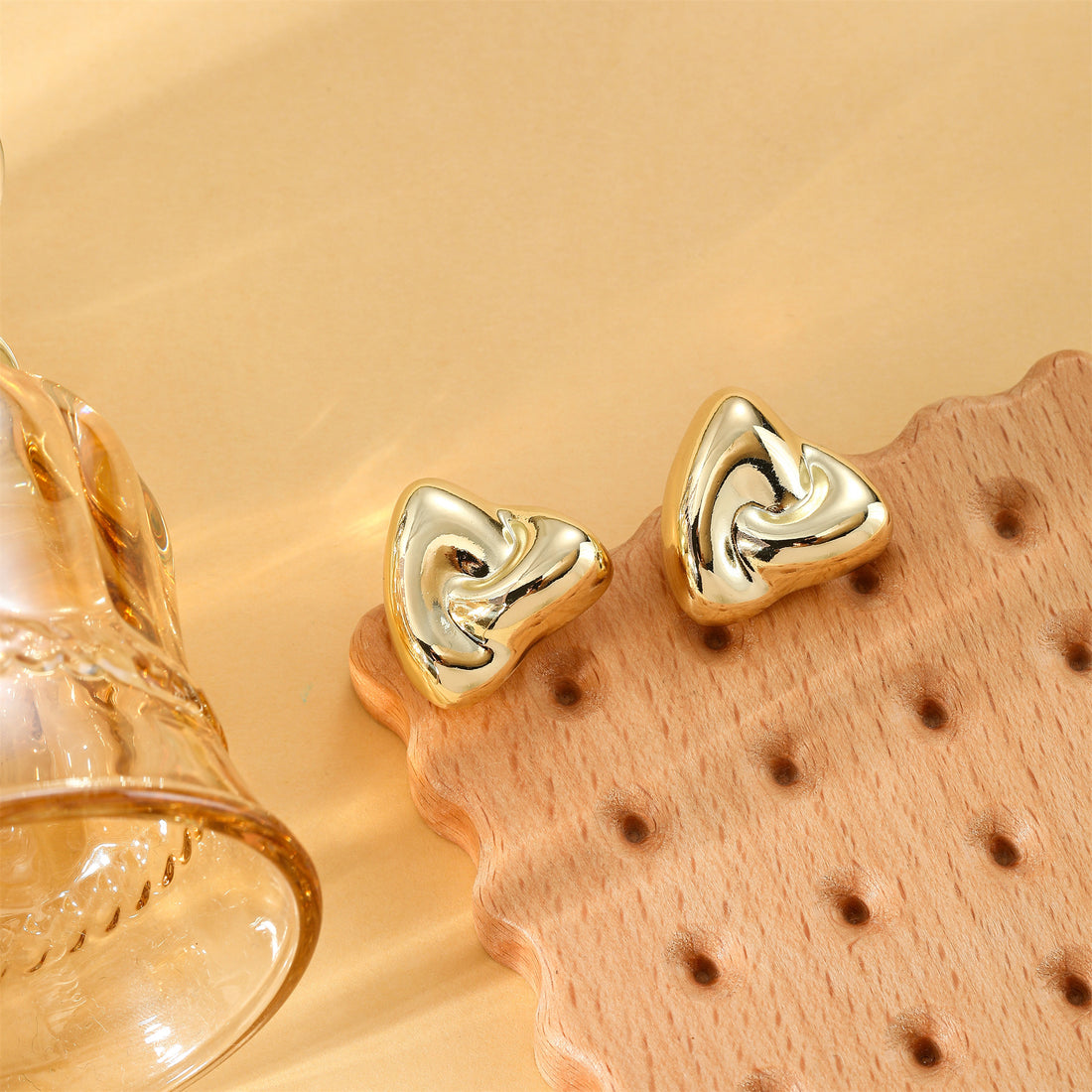 Golden, triangular rice and vegetable roll shaped earrings