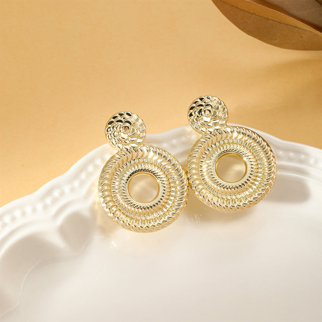 Golden, delicate braided rope pattern hollow round earrings