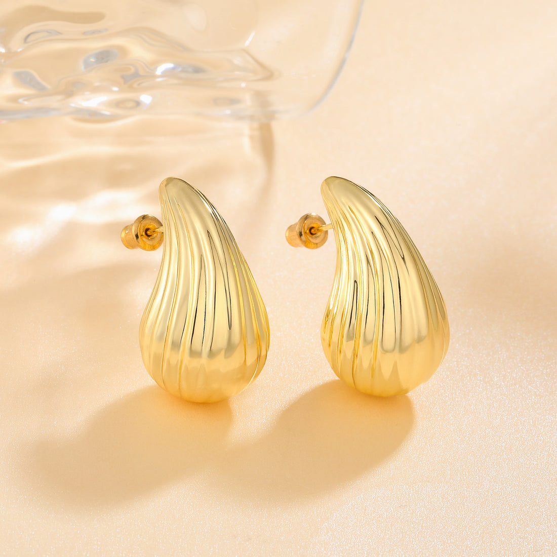 Golden, mango shaped earrings