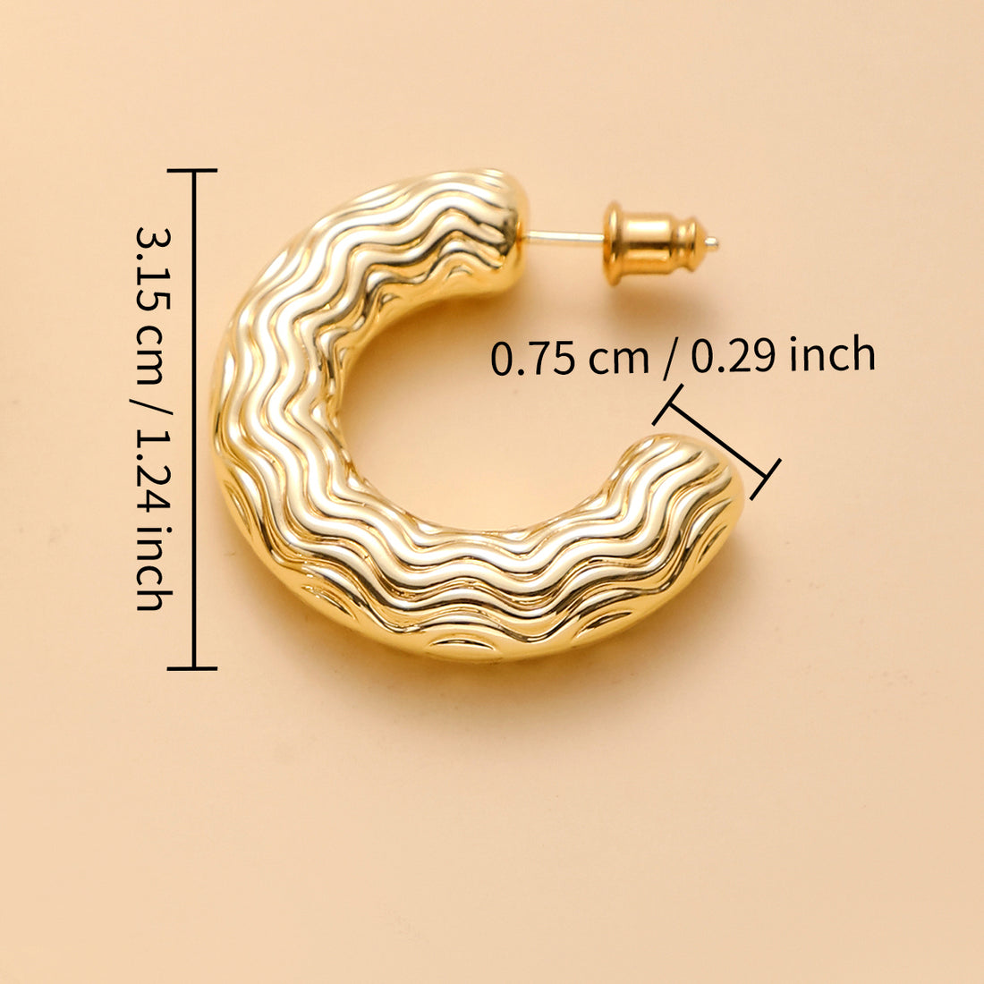 Golden-colored C-shaped earrings with various patterns