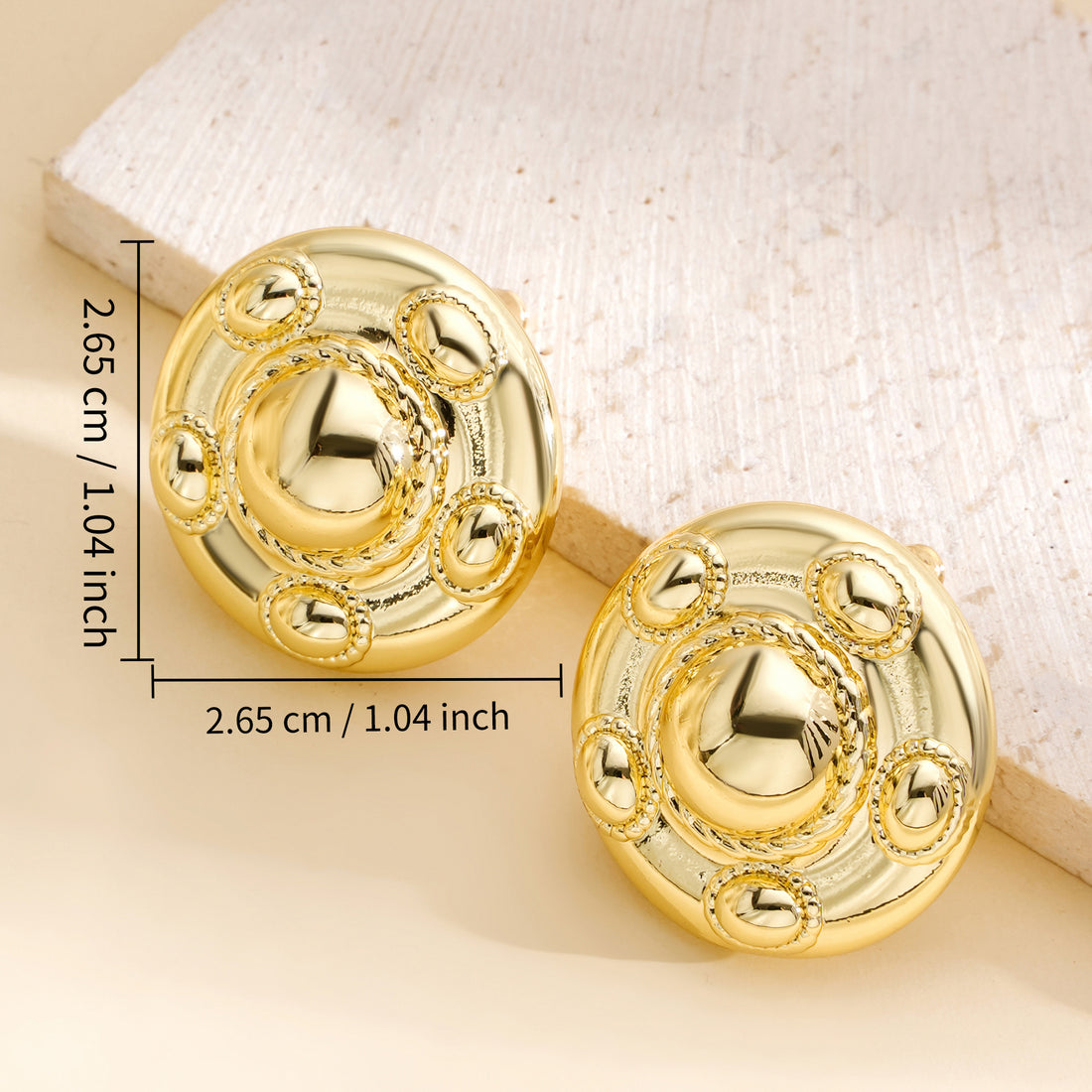 Golde, round disc, with five small round earrings surrounding a large circle