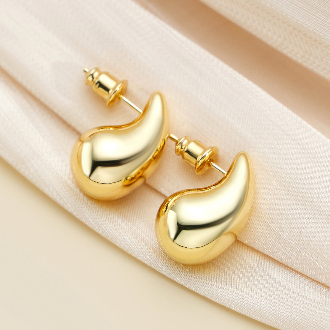 Golden, small bean-shaped earrings
