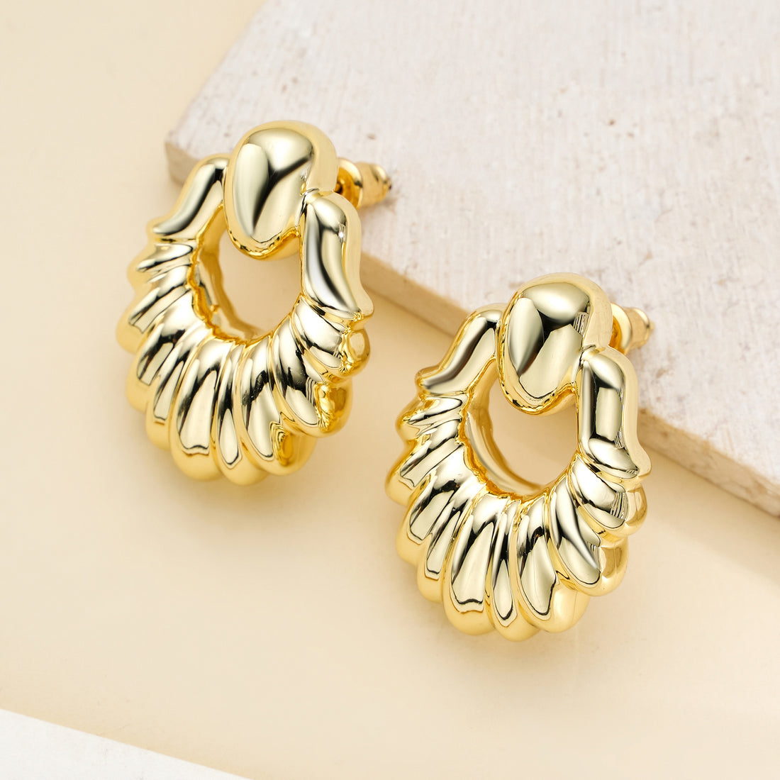 Golden claw-shaped earrings