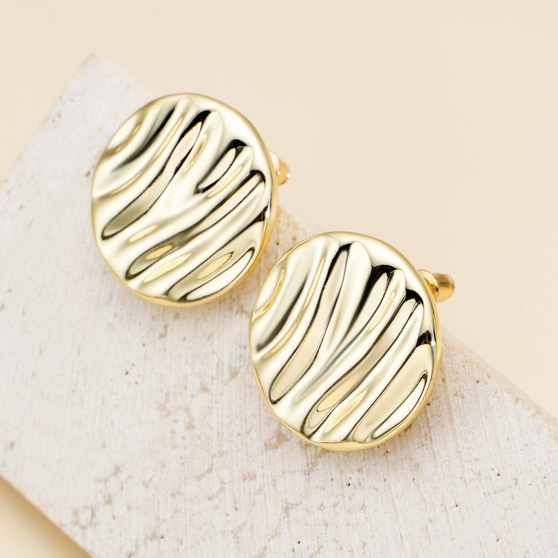 Golden, round disc ripple earrings