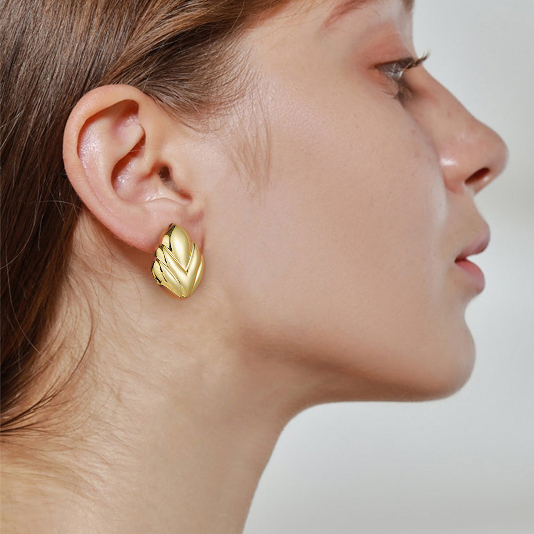 Golden, V-shaped pattern earrings