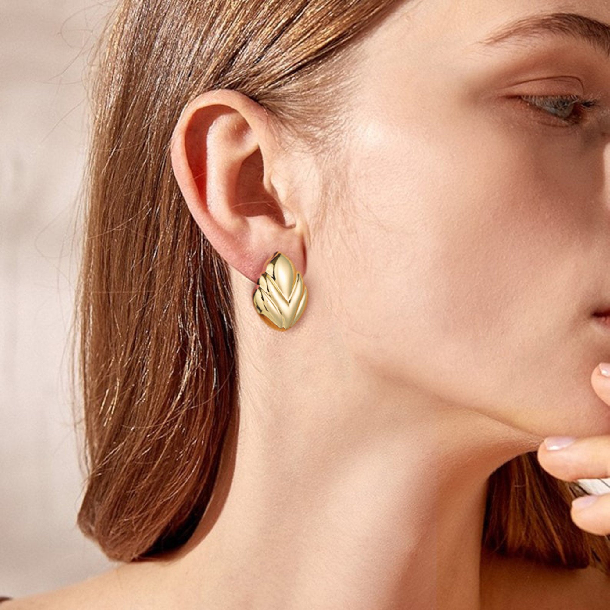 Golden, V-shaped pattern earrings