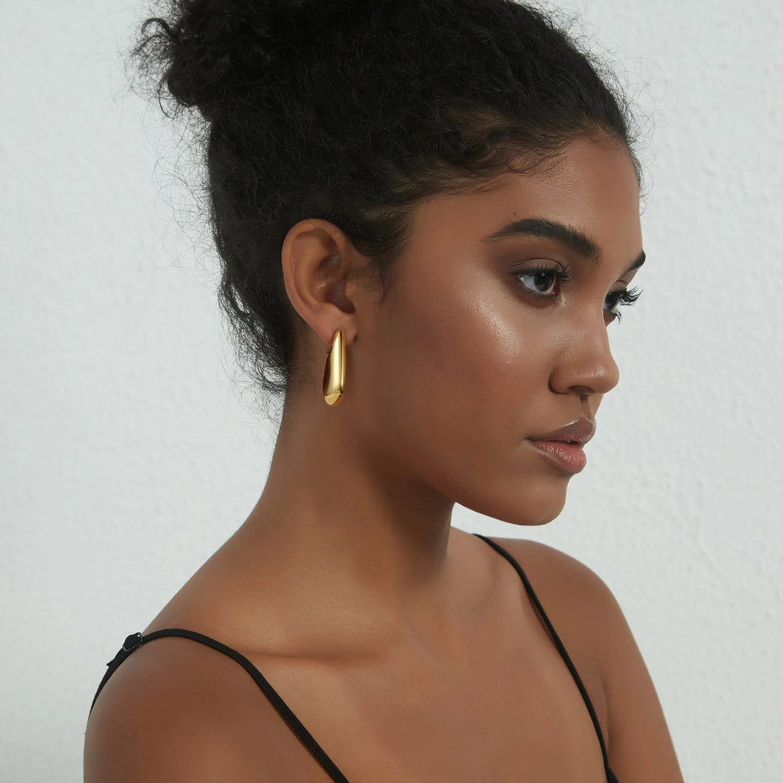 Golden, square handbag-shaped earrings