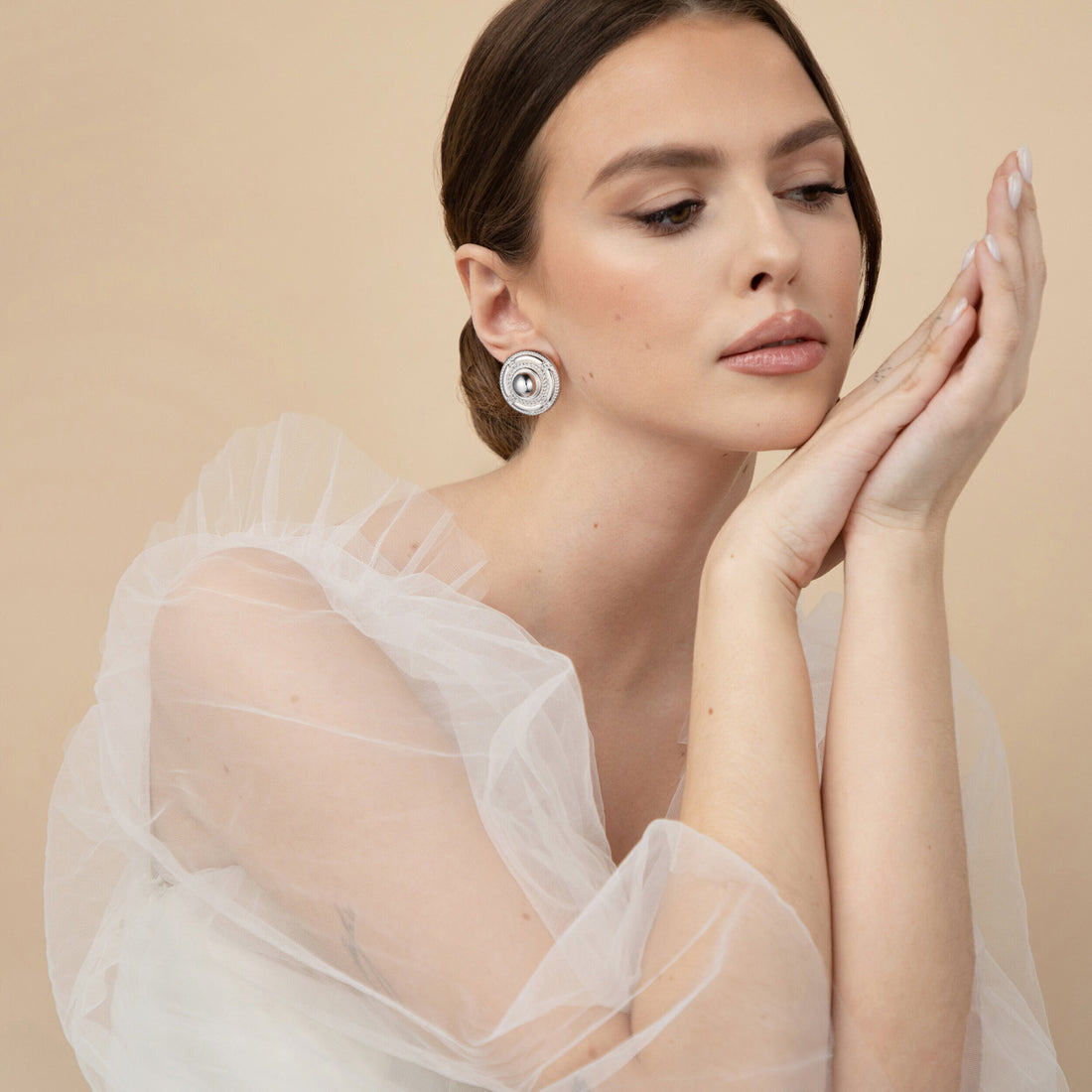 Silver/golden, round shield-shaped earrings